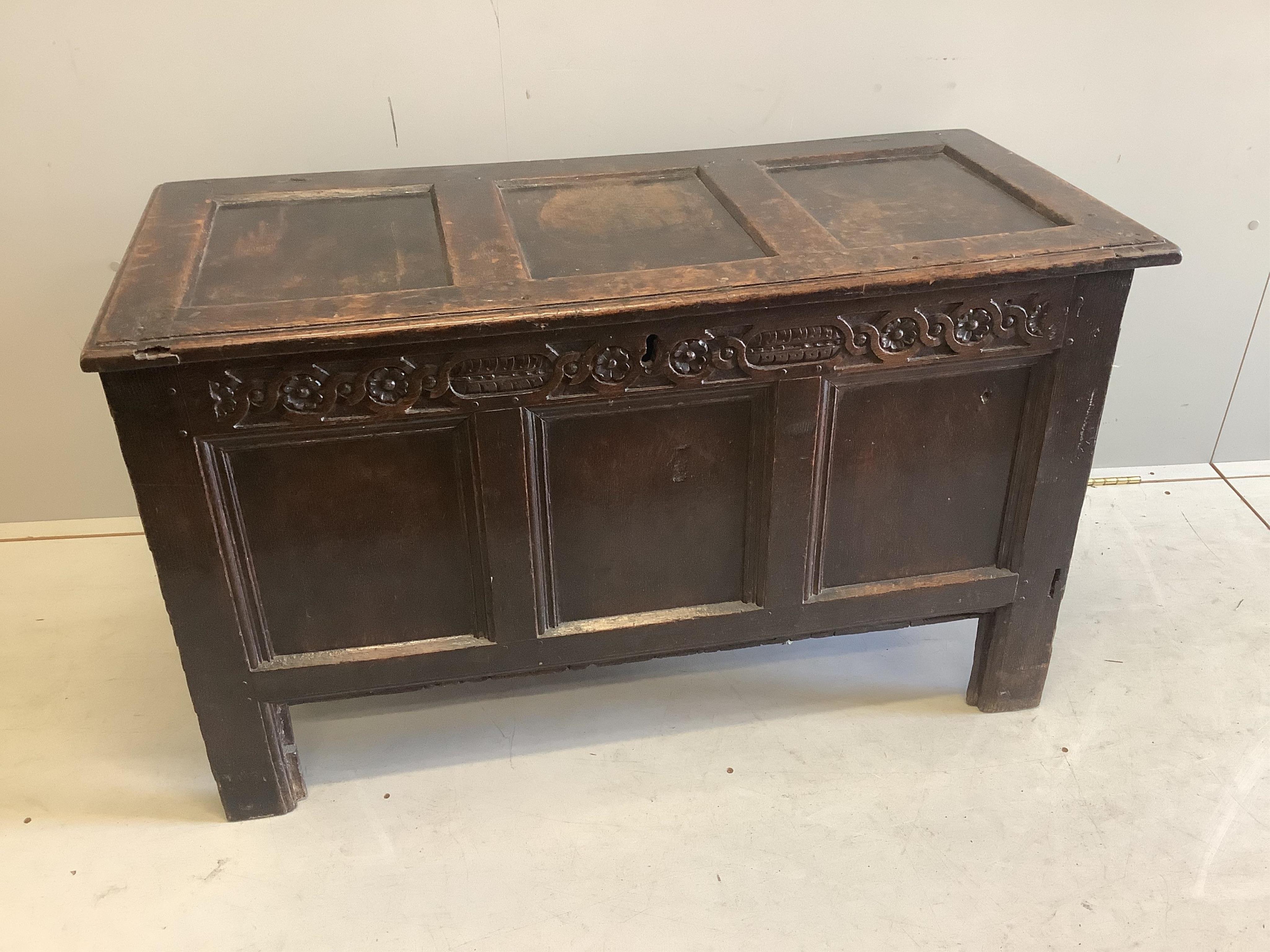 A late 17th century oak coffer three panel top, width 102cm, depth 50cm, height 165cm